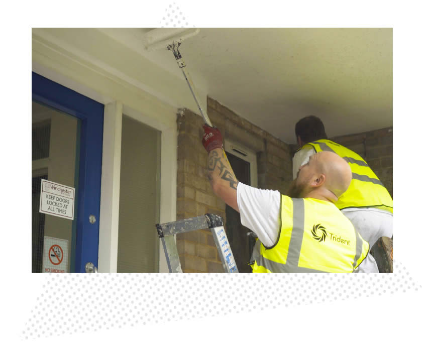 The trident team working on a building